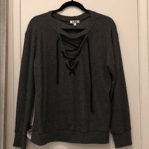 LNA Waffle knit lace up sweater